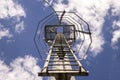 Inside view of a metal long lamppost with internal staircase and lighting lamp built to illuminate the sports field