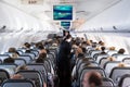 Inside view on passenger and cabin crew people on an airline airplane during flight vacation. Transportation tourism aviation