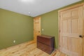 Inside view of a rustic-designed room with green-toned wall Royalty Free Stock Photo