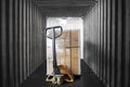 Inside view of shipping container. Cargo shipment boxes stacked on pallet with hand pallet truck. Industry cargo freight transport Royalty Free Stock Photo