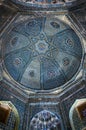 An inside view of the Shodimulk Oqo Mausoleum of the 14th century with golden-and-turquoise patterns