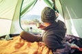 Inside view from tent. Traveler looks on mountain hills panorama Royalty Free Stock Photo