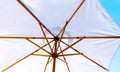 Inside view of wood beach umbrella against blue sky. Concept of summer vacation and holiday Royalty Free Stock Photo