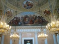 Ceiling frescoes with crystal hanging chandeliers in Villa Torlonia to Rome in Italy.