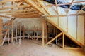 Inside wall heat isolation with mineral wool wooden house, building under construction Royalty Free Stock Photo