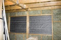 Inside wall heat isolation with mineral wool in wooden house, building under construction Royalty Free Stock Photo