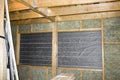 Inside wall heat isolation with mineral wool in wooden house, building under construction