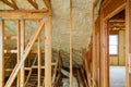 Inside wall insulation in wooden house, building under construction Royalty Free Stock Photo