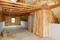 Inside wall insulation in wooden house, building under construction Royalty Free Stock Photo