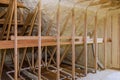 Inside wall insulation in wooden house, building under construction