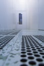 Inside white sterile cleanroom .Hallway with raised floor and door in cleanroom for pharmaceutical or electronic semiconductor Royalty Free Stock Photo