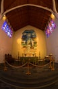 Inside wooden church with beautifull stained glass at Skalholt