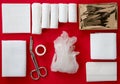 Insides of a First-Aid kit isolated on a red background