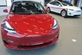 The insignia of Tesla on the front bonnet of the plug-in electric car Model 3