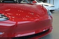 The insignia of Tesla on the front bonnet of the plug-in electric car Model 3