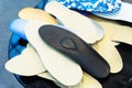 Orthopedic insoles. Large selection of shoe accessories in a specialized store. Close-up Royalty Free Stock Photo