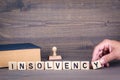 Insolvency. Wooden letters on dark background Royalty Free Stock Photo