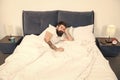 Insomnia. Sleep disorders concept. Man bearded hipster having problems with sleep. Guy lying in bed try to relax and Royalty Free Stock Photo