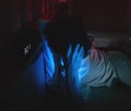 Insomnia sleepless man having problem sleeping in late night with alarm clock telling late night time on his bed Royalty Free Stock Photo