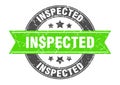 inspected round stamp with ribbon. label sign