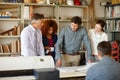 Inspecting every detail of their building plan. a group of architects working together in an office. Royalty Free Stock Photo