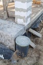 inspection manhole and concrete foundation porches with supporting columns of foam blocks on the perimeter Royalty Free Stock Photo