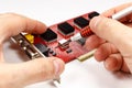 Inspection of electronic components DVR motherboard on white background Royalty Free Stock Photo