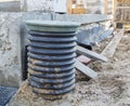 inspection manhole and concrete foundation porches with supporting columns of foam blocks on the perimeter Royalty Free Stock Photo