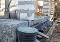 inspection manhole and concrete foundation porches with supporting columns of foam blocks on the perimeter Royalty Free Stock Photo