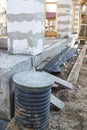 inspection manhole and concrete foundation porches with supporting columns of foam blocks on the perimeter Royalty Free Stock Photo