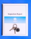 Inspection Report and House Keys on Blue