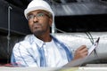 inspector with clipboard in roof space Royalty Free Stock Photo