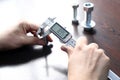 Inspector is measuring diameter of the bolts with a manual verniel caliper micrometer gauge. The Vernier caliper is an extremely. Royalty Free Stock Photo
