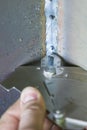 The inspector is measuring to fillet weld thickness with welding caliper