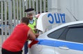 An inspector of the road police patrol service makes a report on the violation of traffic rules. Royalty Free Stock Photo