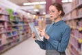 Inspector with tablet in supermarket. Quality control