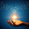Inspiration concept: hand holds glowing light bulb with network Royalty Free Stock Photo