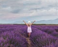 Inspiration and creativity concept, woman in inspiring landscape of lavender blooming field