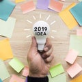 2019 Inspiration ideas concepts with hand holding white lightbulb Royalty Free Stock Photo