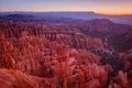 Inspiration Point during beautiful sunrise, with hoodoos - unique rock formations from sandstone made by geological erosion