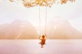 Inspiration, travel and daydream concept, beautiful young woman romantic dreamer on the swing Royalty Free Stock Photo