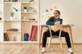 Inspiration. Young woman in casual clothes drinking coffee or tea, thinking about work while while sitting at her