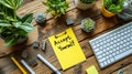 Inspirational Accept Yourself note on a sticky paper over a yellow notebook, with office supplies and keyboard on a wooden