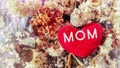 inspirational love concept - MOM text on heart shaped in vintage