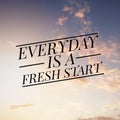 Inspirational motivating quote on nature background. Everyday is a fresh start. Royalty Free Stock Photo