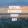 Inspirational motivation quote GETTING STRONGER EVERY DAY on nature sunset background