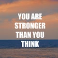 Inspirational motivation quote YOU ARE STRONGER THAN YOU THINK on nature sunset background Royalty Free Stock Photo