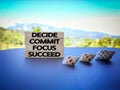 inspirational and motivational concept - Decide commit focus succeed text on wooden blocks with nature background Royalty Free Stock Photo