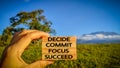 inspirational and motivational - Decide commit focus succeed text on wooden blocks with nature background Royalty Free Stock Photo