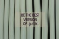 Self Inspirational quote - Be the best version of you. With wooden vertical wall in white painted color background Royalty Free Stock Photo